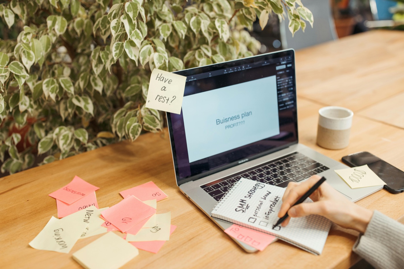 Automation planning desk with sticky-note workflow map